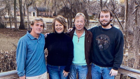 Drew (far right) with his parents and brother.
