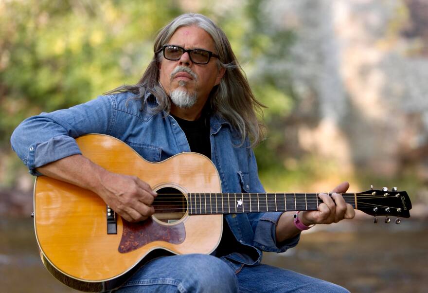 Mark Monroe Gibson playing guitar.