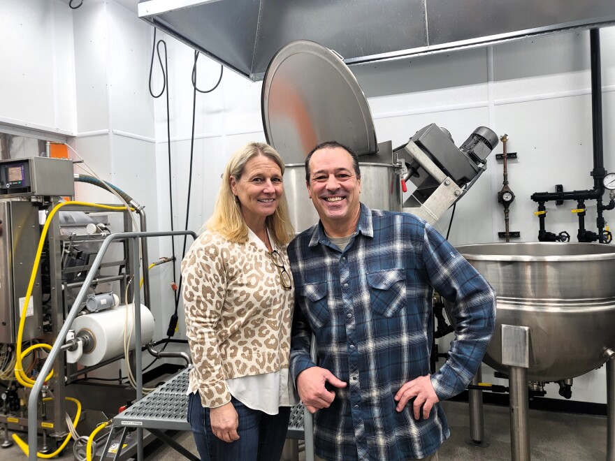 Owners of the Yellowstone Soup Company, Jennifer and Craig Rief stand in the kitchen area of their facility where two steam jacketed kettles perform the major work for their chilis and soups.