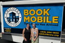 Chicopee librarians Brigitte Lyman and Beth Oliveria with the Chicoppee bookmobile at the Cabot Manor youth center.