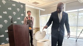 Mayor Quinton Lucas tests Mill food recycling bin by dumping a tangerine peel inside 