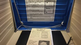 A voting booth in Hudson, Ohio with a ballot, nestled inside a secrecy sleeve