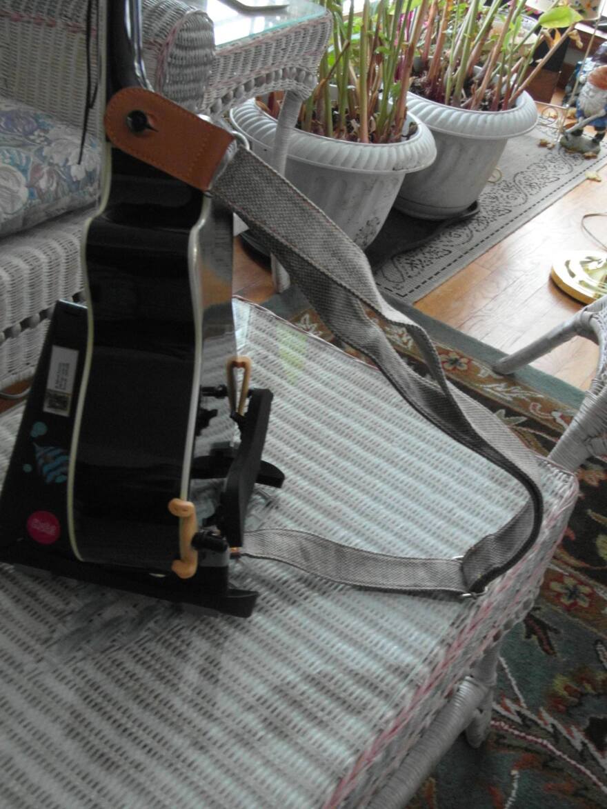 Uke accessory to stabilize the ukulele for players with no use of elbow