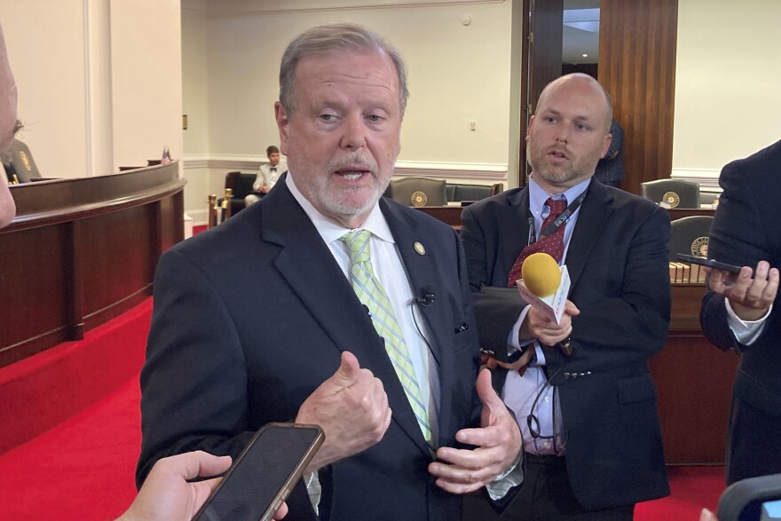 North Carolina state Senate leader Phil Berger, left, R-Rockingham, speaks to reporters on the Senate floor of the Legislative Building in Raleigh, N.C., on Wednesday, May 31, 2023. Berger voted for a measure that would legalize sports wagering in the state. (AP Photo/Gary D. Robertson)