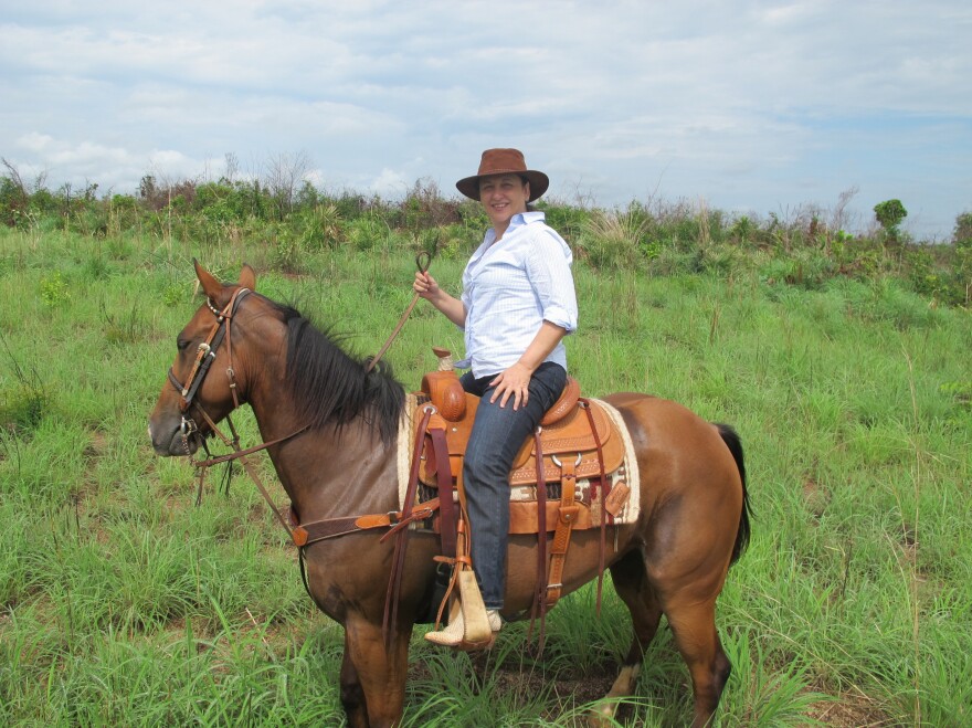 Abreu surveys the farm she owns in Tocantins state in north-central Brazil, on horseback.