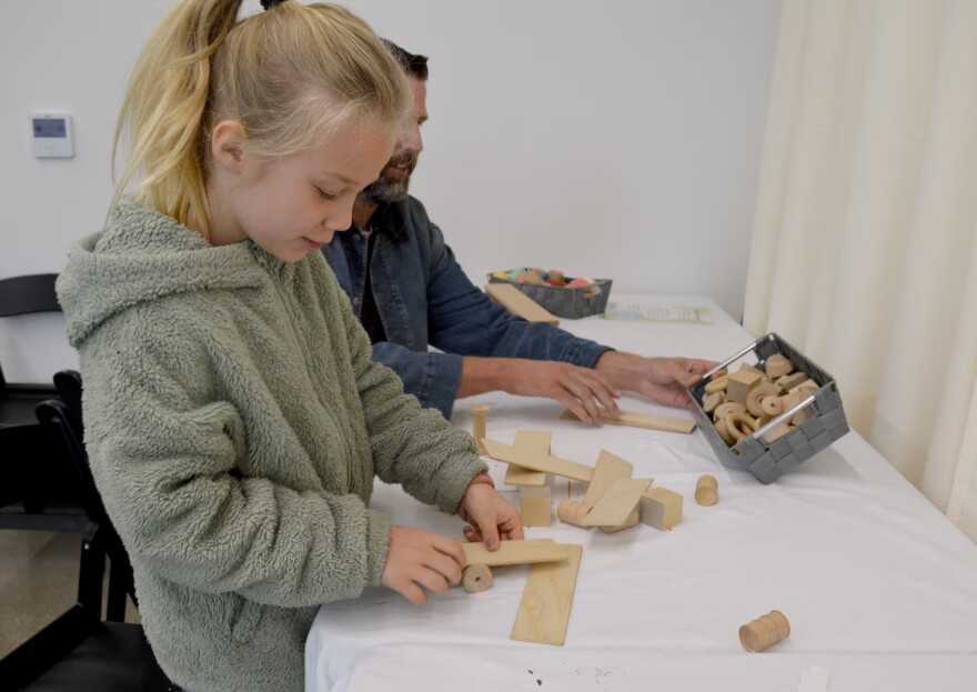 Kora Neil, 7, and her father Ryan Neil build together at the Central Oregon Children’s Museum pop-up event in Bend on Oct. 11, 2026.