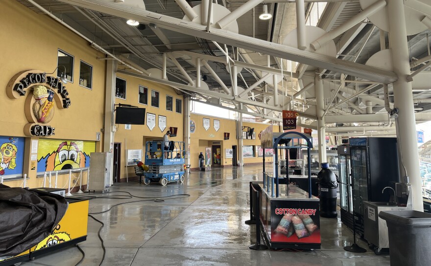 The concourse of Isotopes Park gets a good washing down Monday in advance of Tuesday's game.