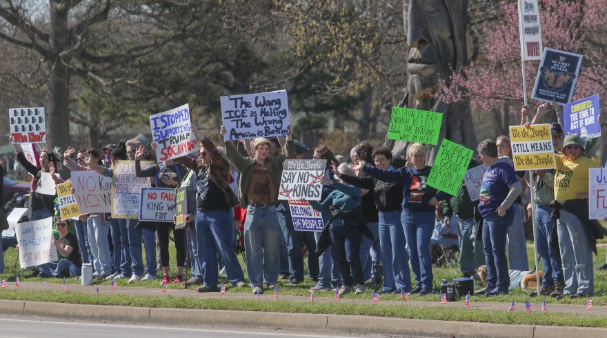Protesters at Paducah's No Kings protest held signs facing Park Avenue speaking out against a variety of actions the Trump administration has taken since the president was inaugurated in 2025.