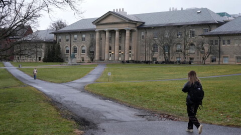 People walk on the campus of Cornell University in Ithaca, N.Y., in 2024.
