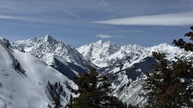 From left, Pyramid Peak and the Maroon Bells are seen from Aspen Highland Ski Resort. The three fourteeners are in the Maroon Bells-Snowmass Wilderness, overseen by the U.S. Forest Service, which uses the NEPA process to govern certain projects.