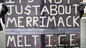 Protestor in Merrimack, where the federal government has plans to convert a warehouse into an immigrant detention facility.