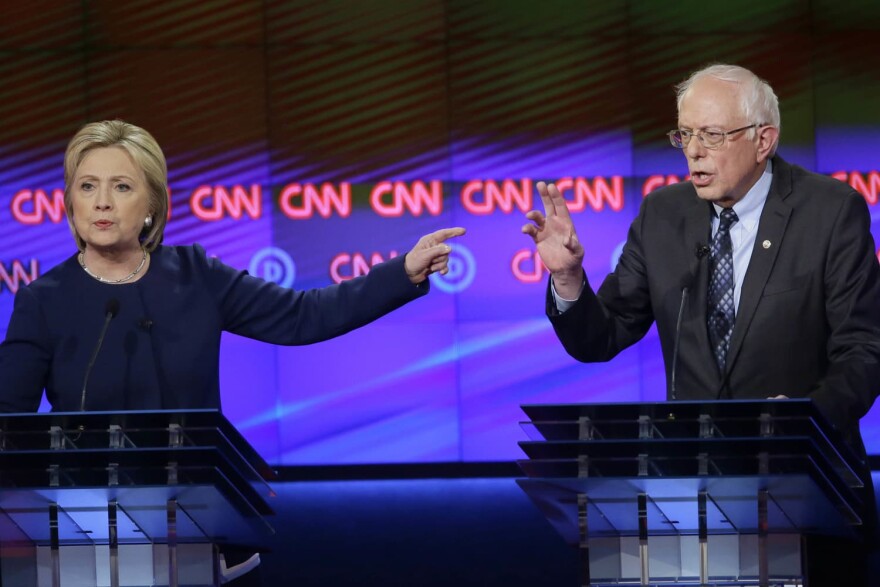 FILE - In this March 6, 2016 file photo, Democratic presidential candidates Hillary Clinton, left, and, Sen. Bernie Sanders, I-Vt., during a Democratic presidential primary debate (Carlos Osorio/AP File)
