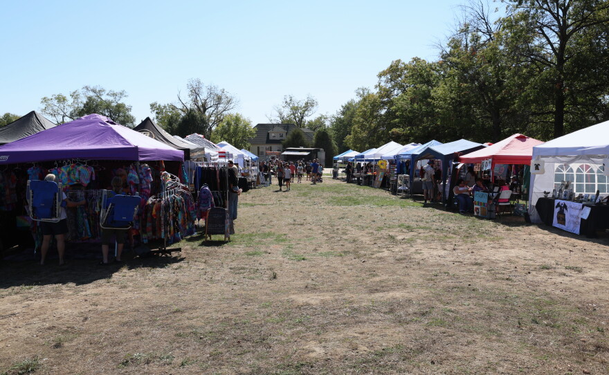 Two rows of tents are set up for vendors and artisan booths at the park in Joplin's North Heights neighborhood.