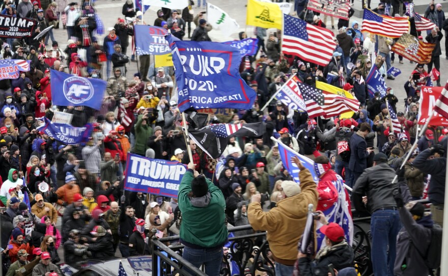 FILE - In this Jan 6, 2021, file photo, violent protesters gather outside the U.S. Capitol in Washington during the deadly insurrection at the U.S. Capitol. (AP Photo/Andrew Harnik, File)