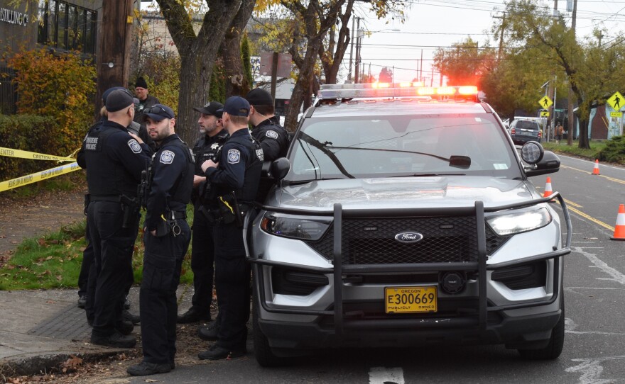 Police near 1st and Madison in Eugene, Nov. 12, 2025.