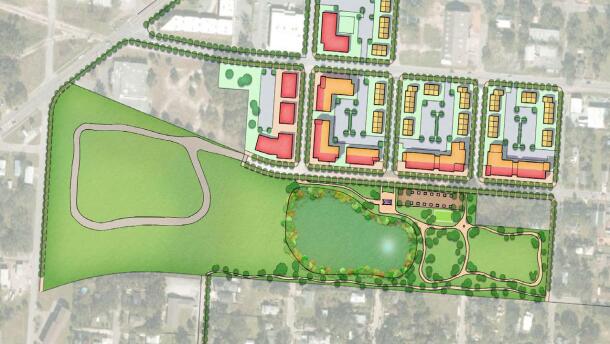 Conceptual site plan showing a proposed park with walking paths, open lawn, trees and a central pond, adjacent to new mixed-use buildings arranged in blocks along a street grid in Pensacola’s Westside CRA area.