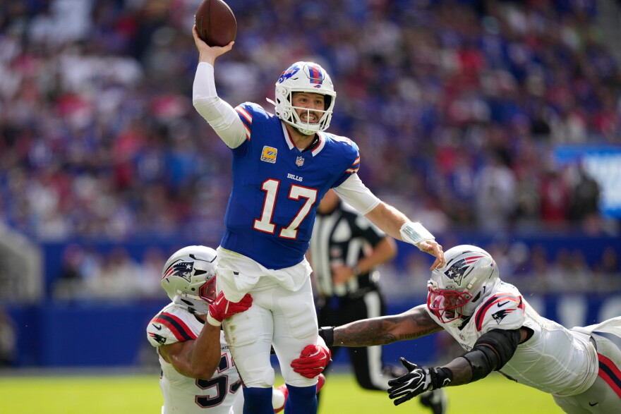 Buffalo Bills quarterback Josh Allen (17) passes against New England Patriots center Jared Wilson (55) and defensive end Dre'mont Jones (5) during an NFL football game in Orchard Park, N.Y., Sunday, Oct. 4, 2026.