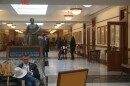 people talking and sitting in the Capitol Extension 