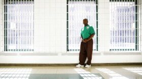 In this Thursday, Aug. 29, 2019 photo incarcerated filmmaker Ezra poses for a portrait at the State Correctional Institution in Chester, Pa. Eastern State Penitentiary, a former prison that's now a museum in Philadelphia is showcasing the work of currently incarcerated filmmakers, projecting the animated shorts onto its outside walls. The new exhibit titled “Hidden Lives Illuminated” offers a glimpse into the lives of these inmates to passersby and museum visitors alike. (AP Photo/Matt Rourke)