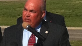 With the BA Expressway as a backdrop, Broken Arrow Chamber of Commerce President Wes Smithwick announces the agreement.