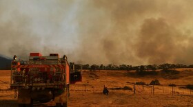 A Rural Fire Service firefighter views a flank of a fire on January 11, 2020 in Tumburumba, Australia. (Sam Mooy/Getty Images)