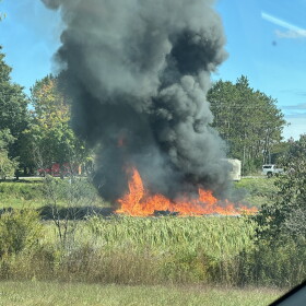 Fire burning after the military plane crash. The plane went down shortly before 2pm on Thursday.