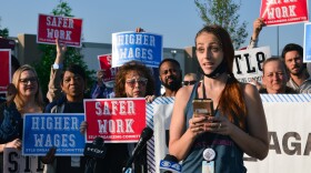  Amazon employee Kayla Breitbarth speaks during the "March on the Boss" event in St. Charles Wednesday. Breitbarth says Amazon has a "toxic culture" that needs to be improved.