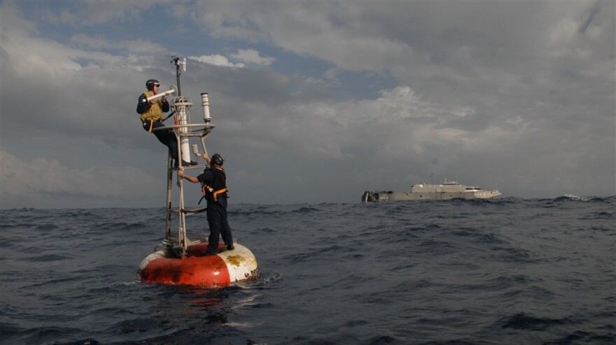 Navy specialists repair a weather buoy collecting data for the National Oceanic and Atmospheric Administration (NOAA) off the Atlantic coast of Africa. President Richard Nixon, a Republican, created NOAA, one of our principal resources for understanding the Earth's climate.