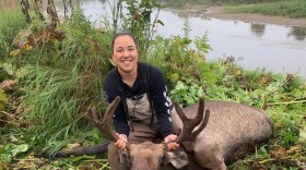 Mindy Heyano with a bull moose. August 2021.