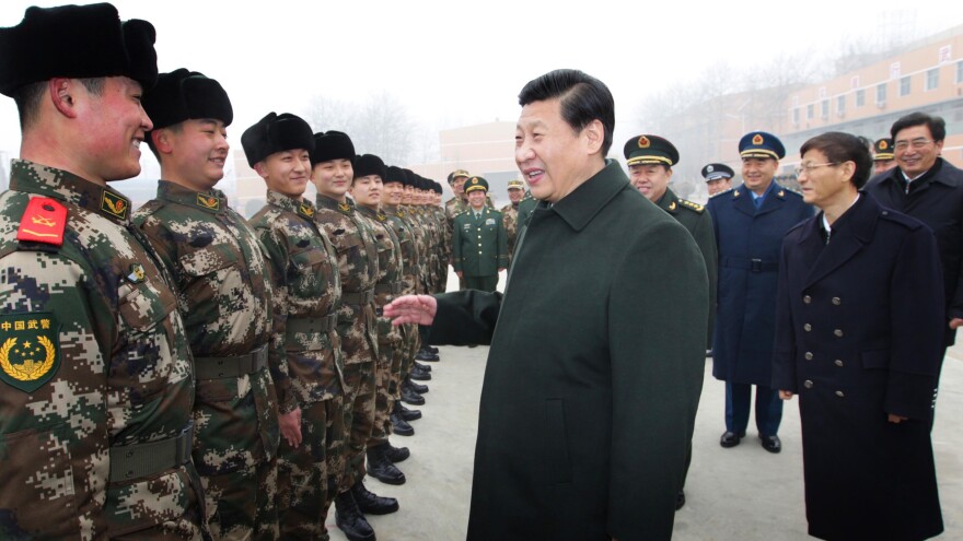 Chinese President Xi Jinping (center) talks with members of the Chinese People's Armed Police Force in Beijing. China has been increasingly assertive in Asia, and many U.S. allies want the U.S. to have a strong presence in the region as a counterbalancing force.