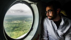 Sami Yenigun flies into Lofa province in a U.N. helicopter.