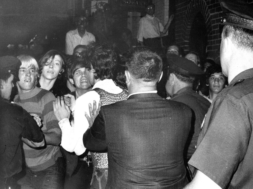 A crowd attempts to impede police arrests outside the Stonewall Inn in New York City on June 28, 1969.
