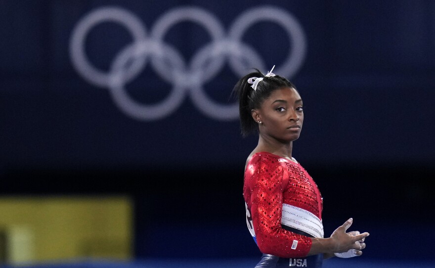 Simone Biles, of the United States, waits to perform on the vault during the artistic gymnastics women's final at the 2020 Summer Olympics, Tuesday, July 27, 2021, in Tokyo. The American gymnastics superstar has withdrawn the all-around competition to focus on her mental well-being.