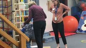 Karen Terp (left) and intern, Sarah, during a child's daily physical therapy session at CP Rochester.