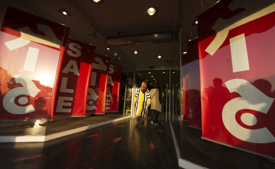 Women enter a store on Tehran's Haft-e-Tir Street.
