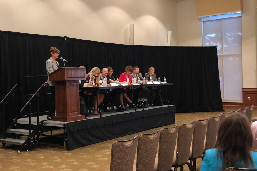 Seven members of the 14-person commission and advisory comittee on teacher pay.