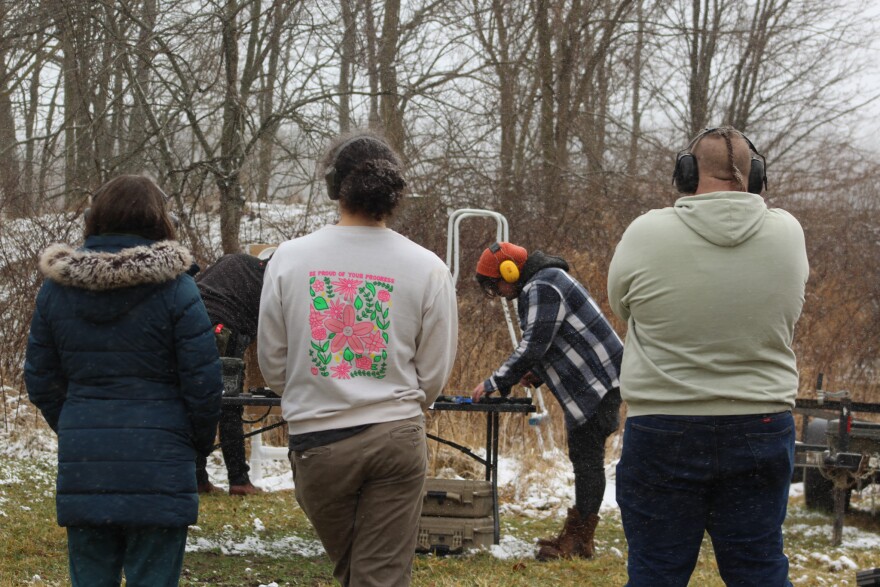 Trainees of the a Liberal Gun Club training in Shelby, Ohio, watch target practice on Feb. 22, 2026.