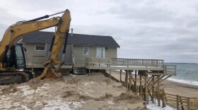 A home on Salt Marsh Road that overlooks Springhill Beach in Sandwich is damaged beyond repair after a February 2021 storm.