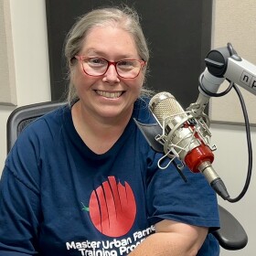 Carey Smith at the mic in NPR Illinois Studio F.