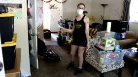 Pinewood Drive resident Maria Smith surveys the flood damage to her home. "The floor is starting to buckle. The floor is still wet," Smith said. "That's why the mask is a big deal - mold is a problem."
