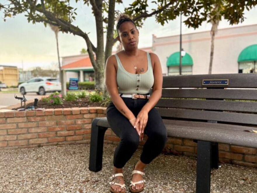 Cierra Capco, a Venice resident and survivor of domestic violence, sits in a park near her home. She now serves on the board of Queens of Domestic Violence and Awareness.