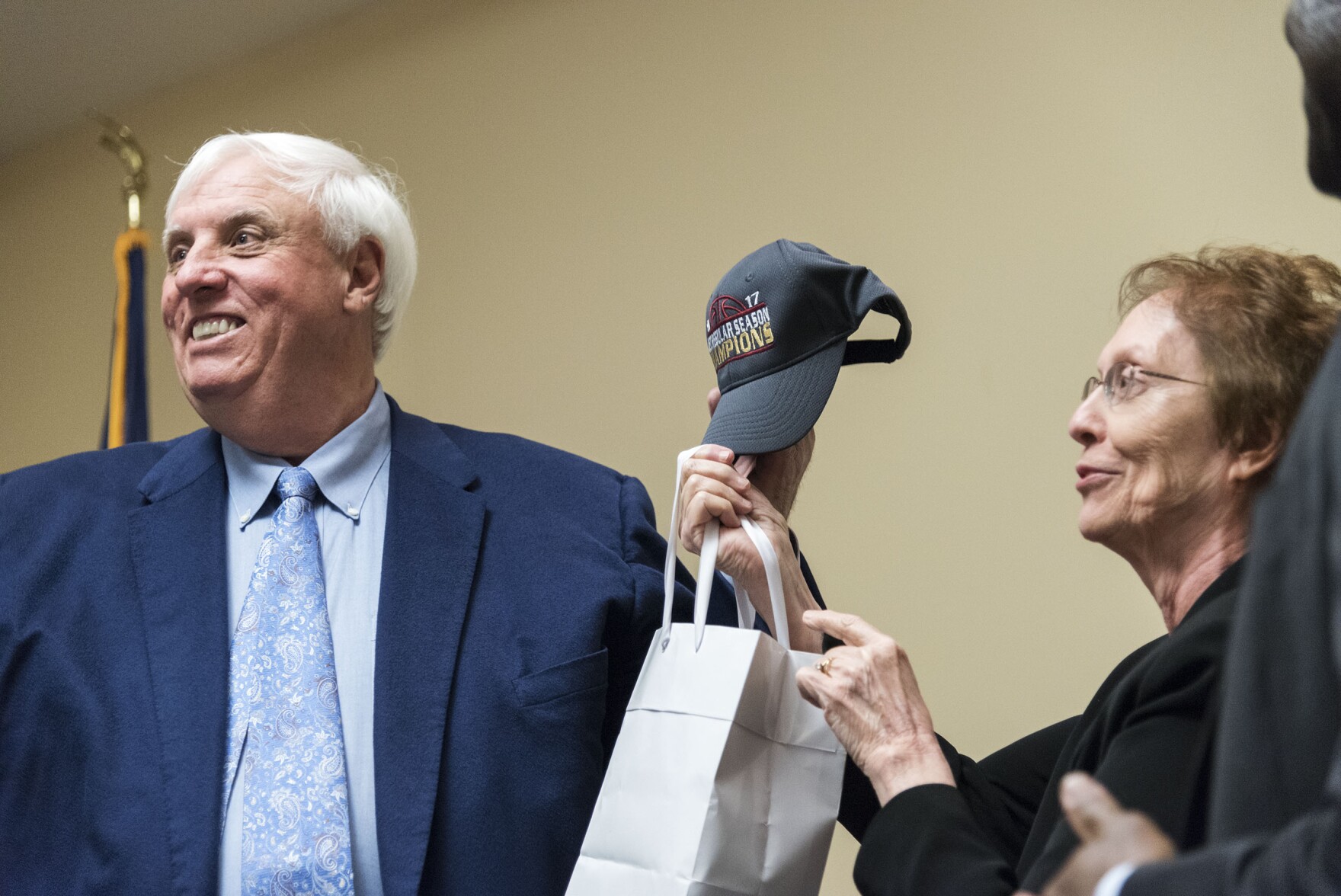 West Virginia Gov. Jim Justice accepts a ball cap from Fairmont State University President Maria Rose after giving a speech during a stop on his Save Our State Tour on Thursday, March 3, 2017, at FSU.