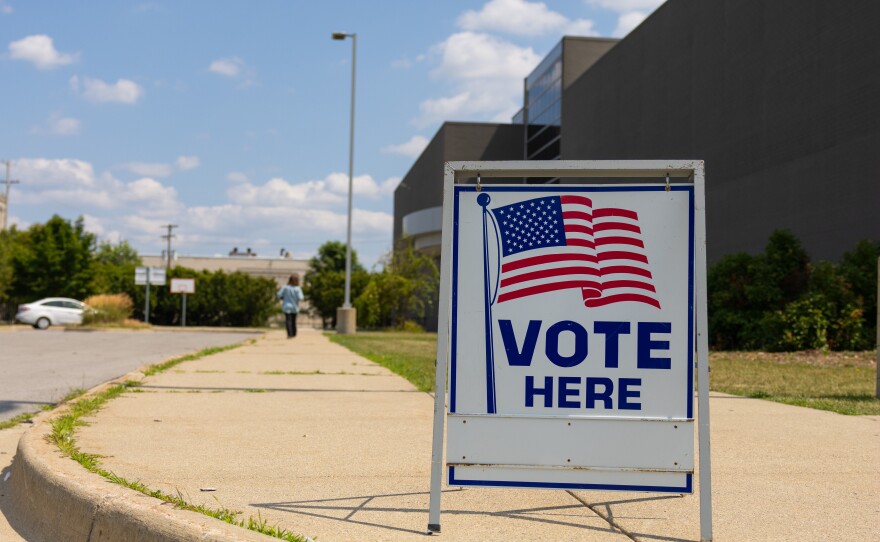 A voter makes her way inside Saginaw United high school to cast her ballot in the August 4 primary election.