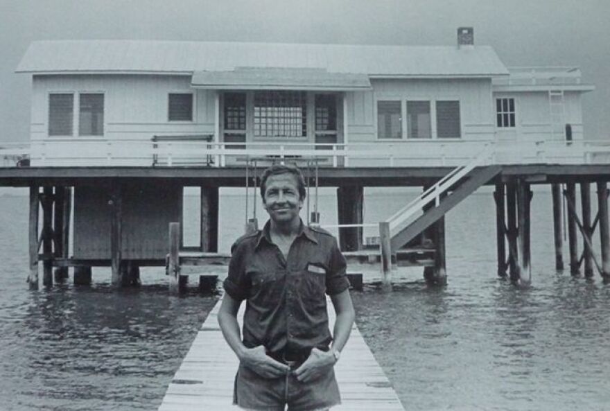Artist Bob Rauschenberg in front of Fish House at Captiva Island compound.