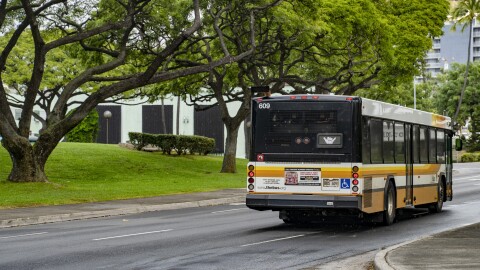 FILE - TheBus displays a shaka after merging into a lane in Honolulu on March 6, 2024.