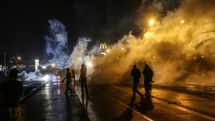 Protesting youth were stranded on the street after curfew when Missouri Gov. Jay Nixon declared a state of emergency and imposed a midnight-to-5 a.m. curfew in Ferguson in August 2014. 