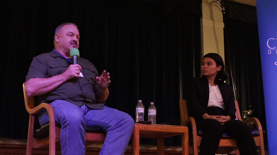 Ward 5 Incumbent Mike Clark (left) speaks while challenger Athena Aguiar (right) looks on during a September 18, 2026 City Club of Eugene forum.