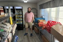 Coordinator Jacob Gordon stands in the Lion’s Share Food Pantry and Clothing Closet at St. Mark’s Lutheran Church in Roanoke.