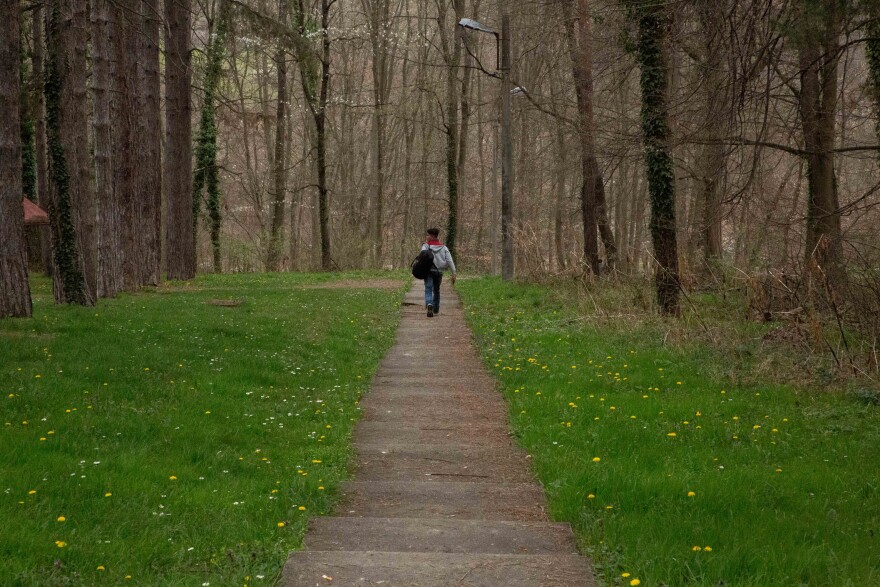 An unaccompanied minor leaves the premises of the asylum center in Bogovadja, Serbia, to try to cross into a neighboring EU country.