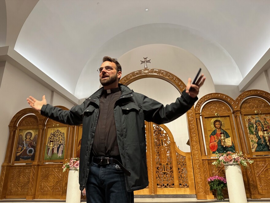 The Rev. Ciprian Streza leads a tour of the nave at Archangel Gabriel Orthodox Church in Williamsburg, Mich.